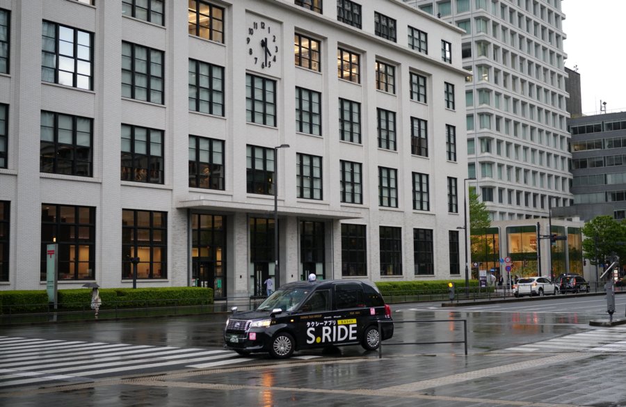 hakuba electronics client project — Tokyo taxi and modern building exterior