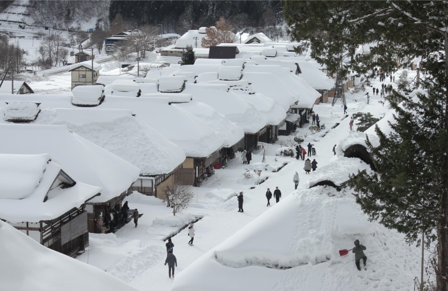 Snow-covered traditional Japanese village in winter