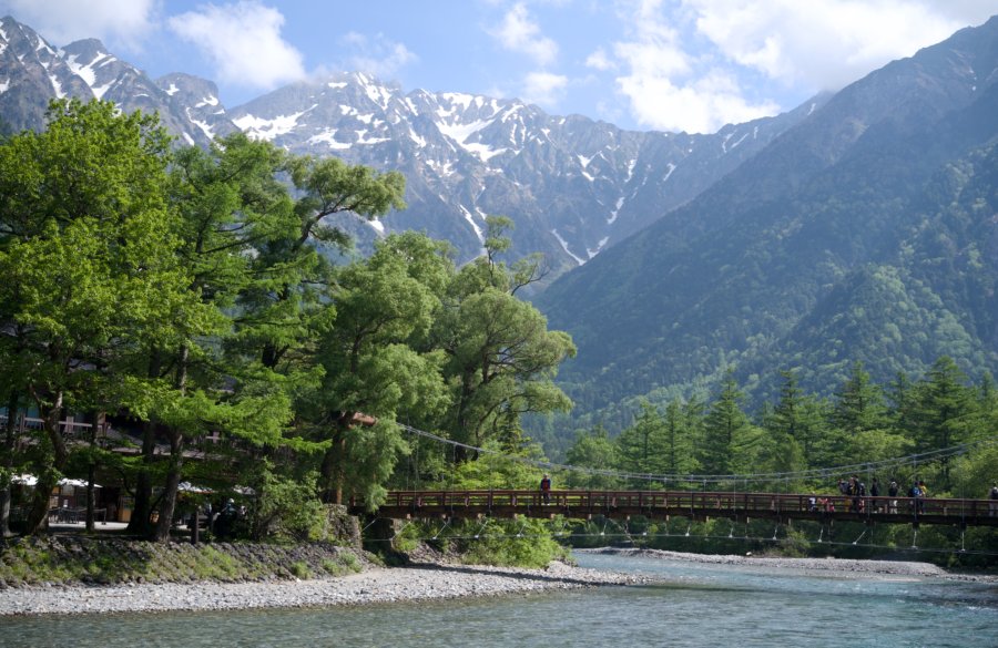 Kamikochi mountain river and suspension bridge in Japan
